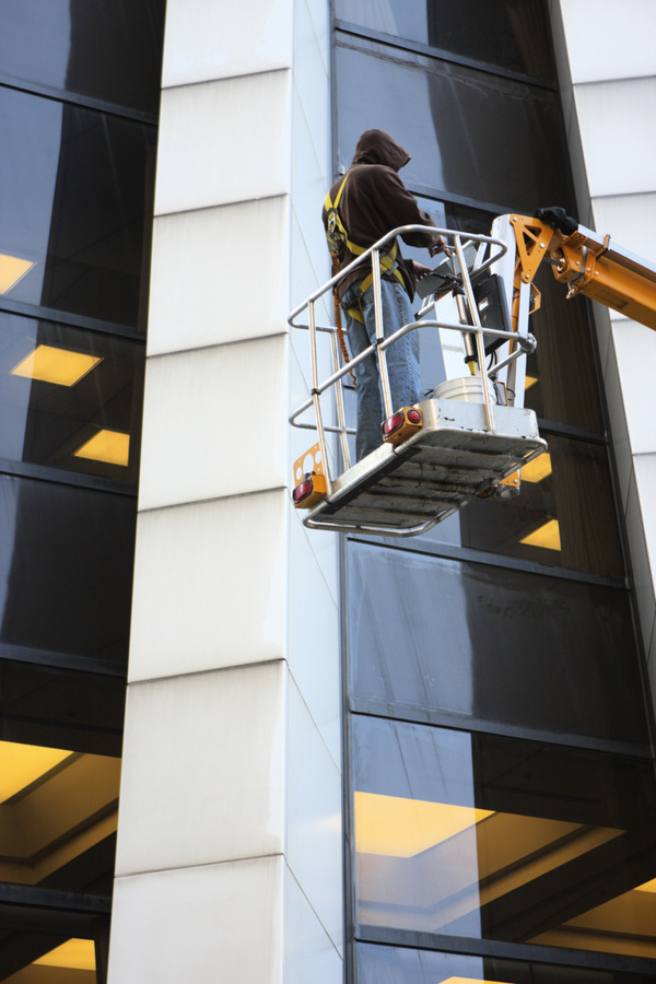 Window Washer Cleans Office Building Glass