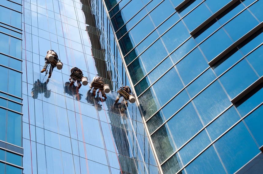 Window washer team cleaning high rise exterior